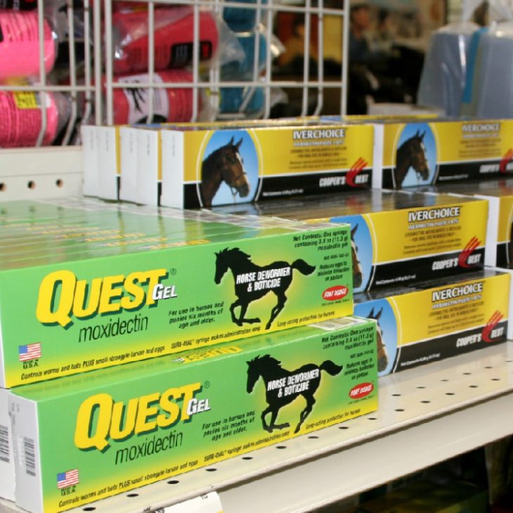 Horse medicine sitting on a shelf in a retail store